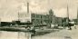 Schiedam industry 3. J.J. Melchers distillery on Noordvestsingel. On the front a small ferry boat, 1906. Author: unknown.